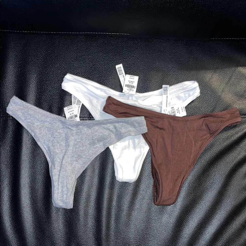 Trio in White, Gray, and Brown